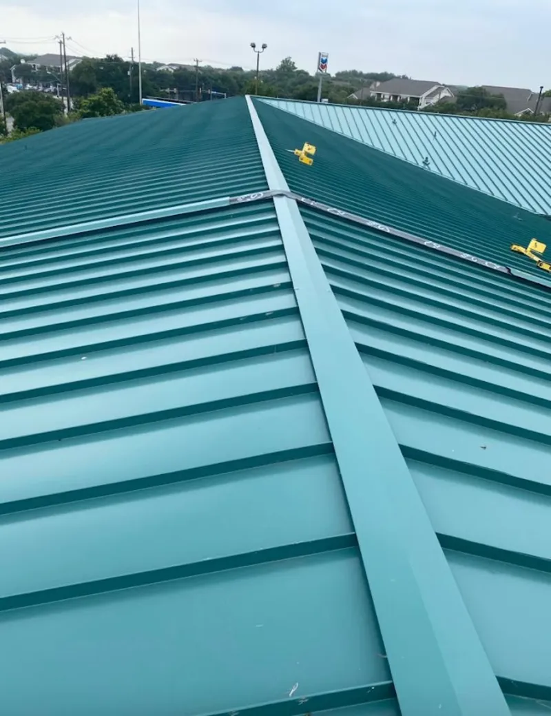 Green commercial metal roof ridge and valley for Metal Roof Repair in Denton